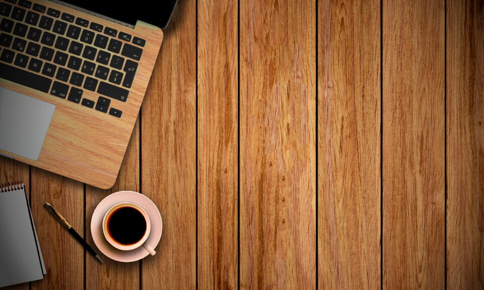 Notepad pen wooden background
