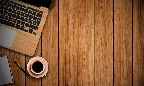Notepad pen wooden background