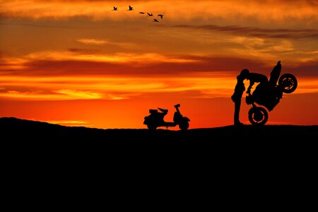Moped sunset silhouette photo