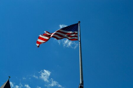 Weather beaten flag war american flag waving photo