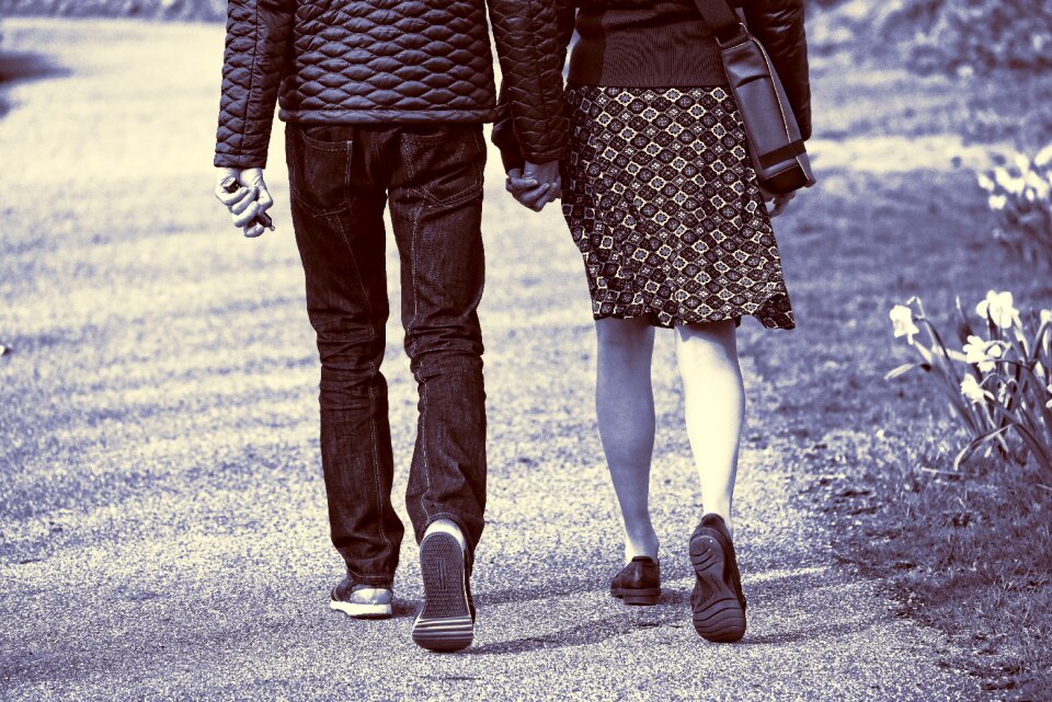 Woman walking hand in hand