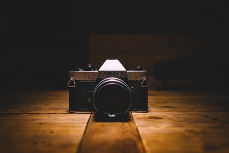 Wooden table gray camera photo