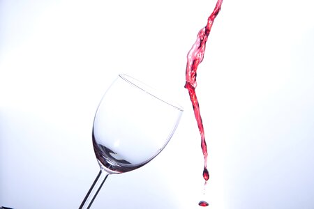 Empty drinking cup wine spill photo