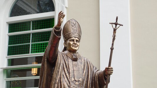 Statue pope hand rising