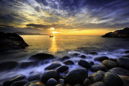 Ocean waves the sun clouds