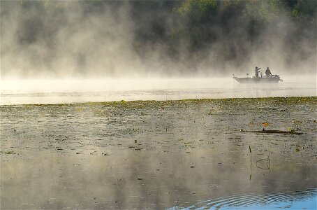 Fishermen water sun photo