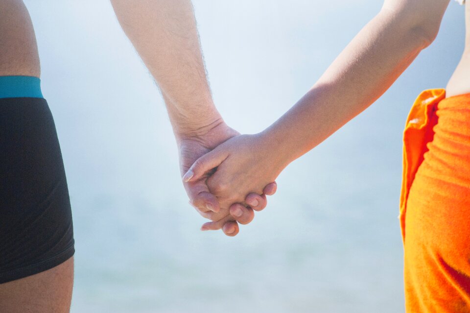 Woman holding hands sky