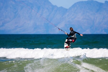 Kite-surfing female action photo