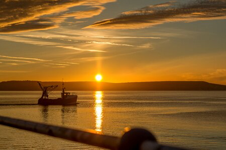 Fishing boat daybreak harbour photo