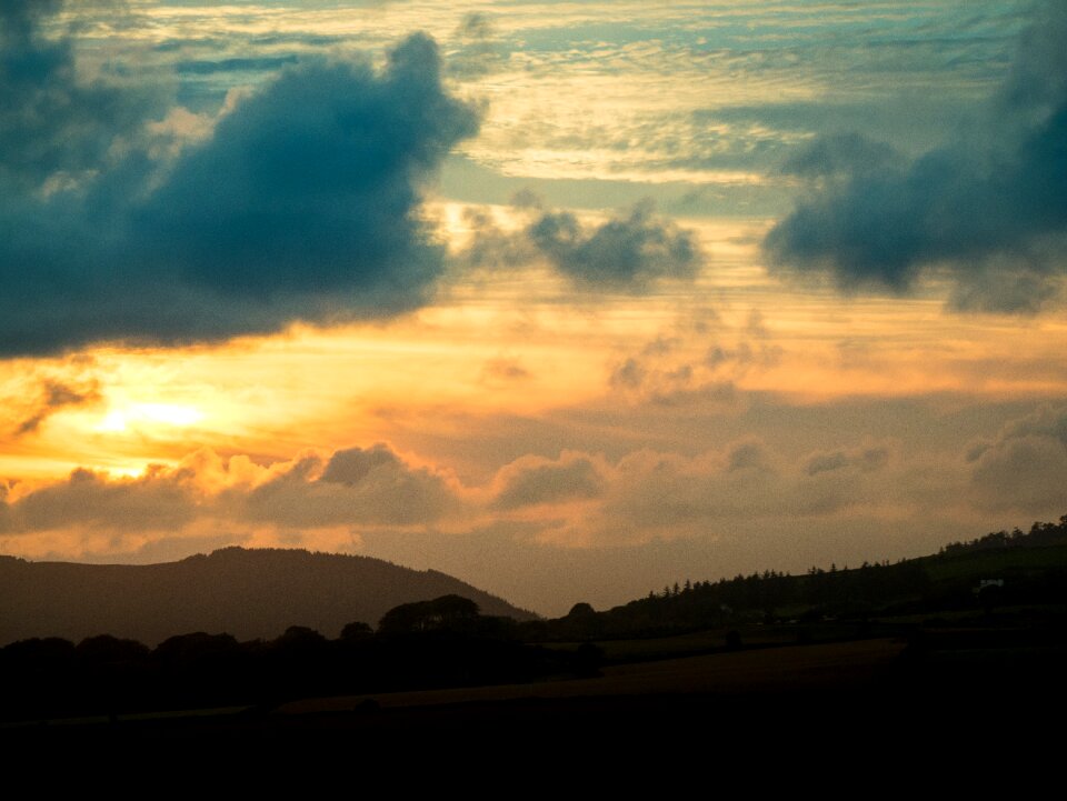 Peaks clouds sky