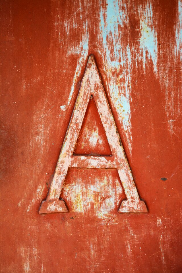 Embossed carved letter