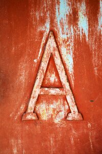 Embossed carved letter