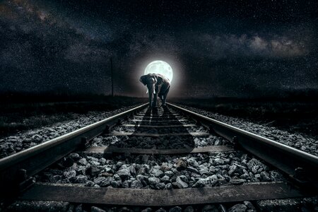 Night full moon railway rails
