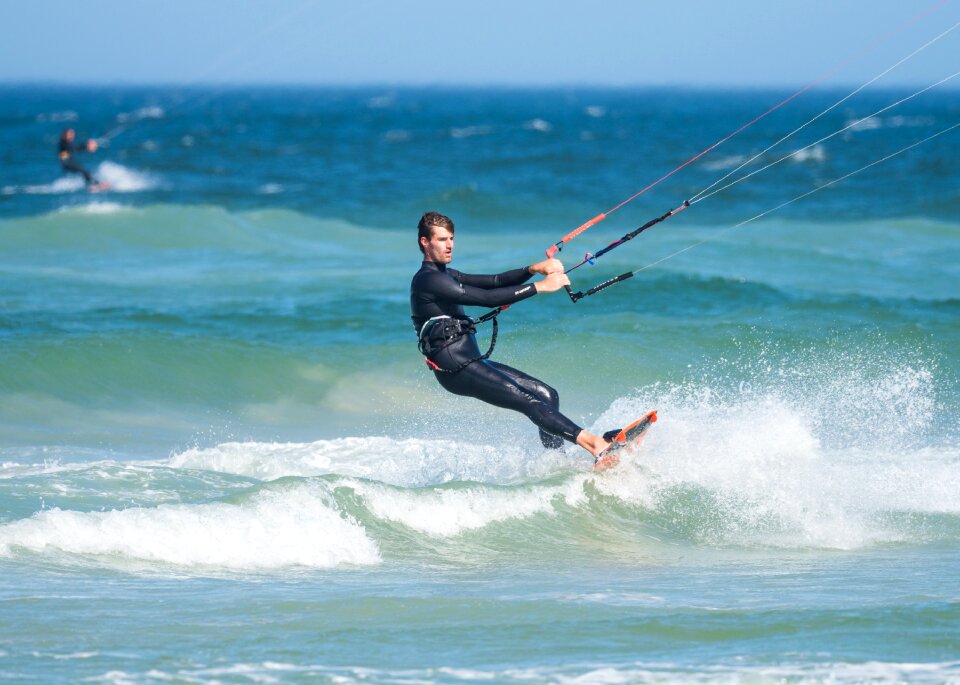 Kite-surfing male action photo