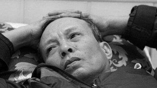 Lying black and white vietnam photo