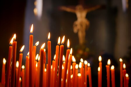 Cross prayer candles light photo