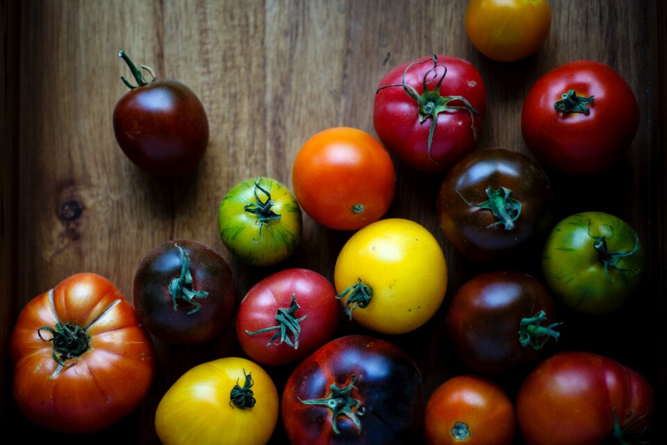 Tomatoes wooden table photo