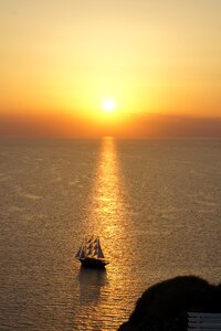 Santorini sunset ship photo