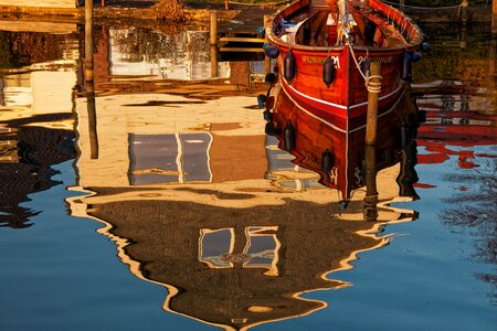 Reflection boat mirroring photo