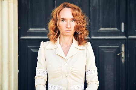 Curly woman green eyes sadness