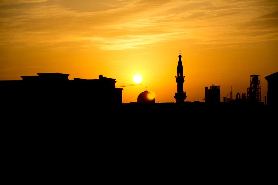 Orange sun setting black sun photo