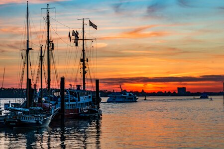 Sailing ships sunset lights