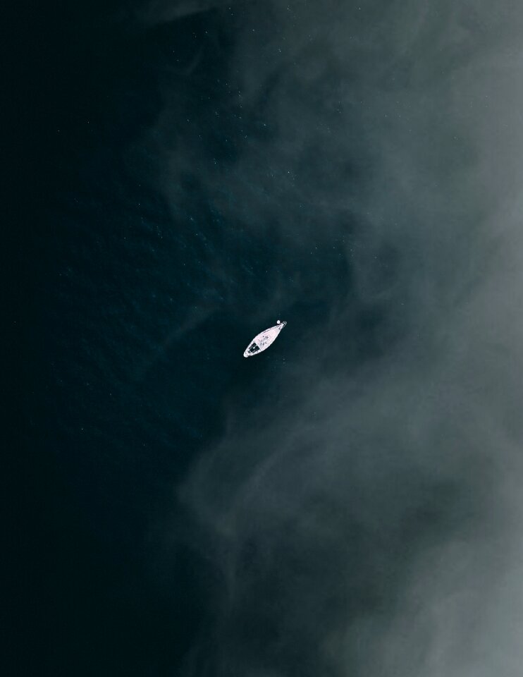 Look from the sky water lonely boat