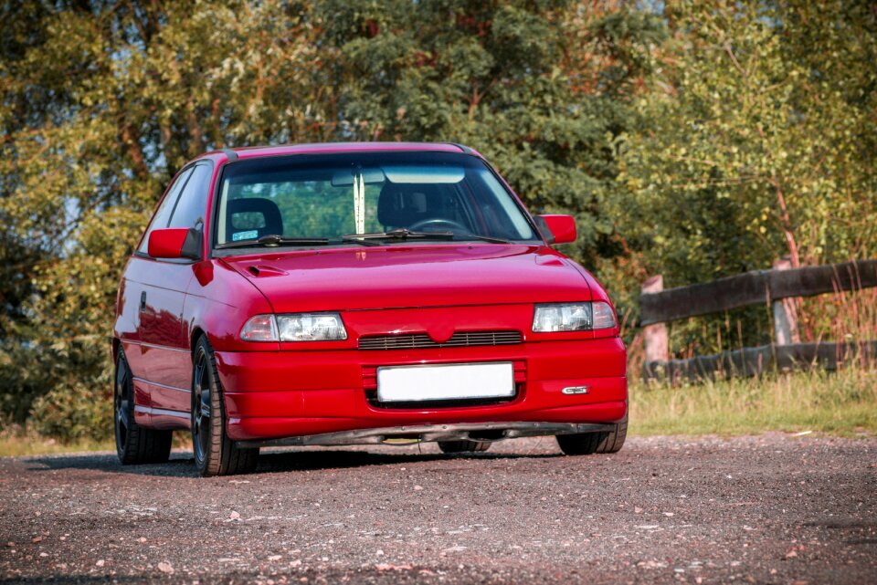 Red hatchback auto
