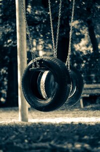 Tire swing children's playground game device