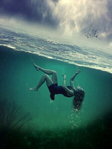 Woman ocean sky