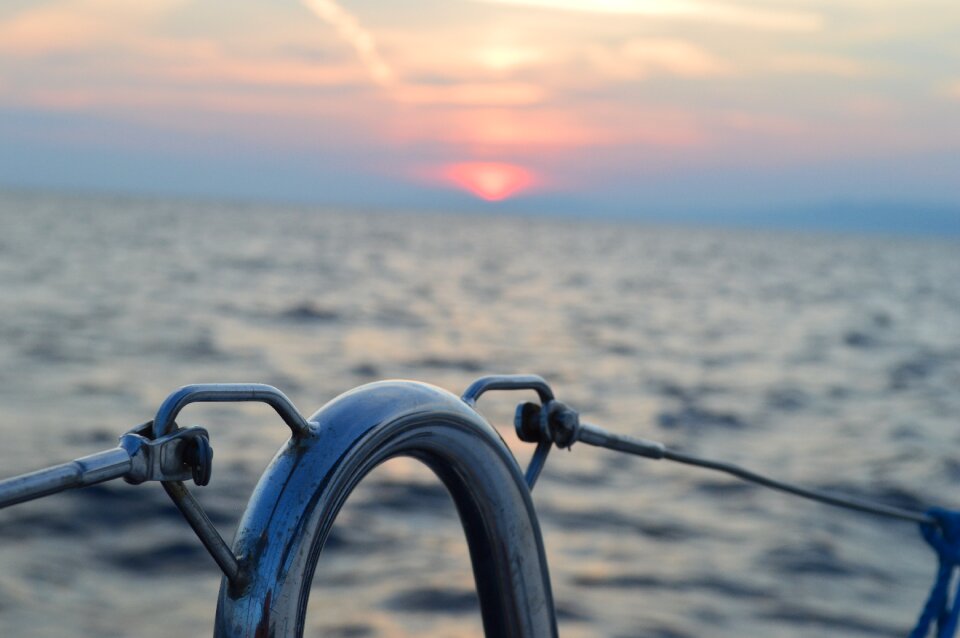 Sunset sailing vessel sea