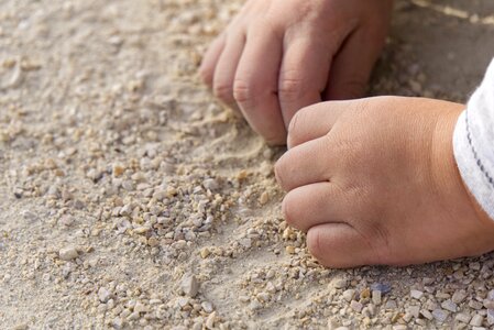 Sand pebble child's hand photo