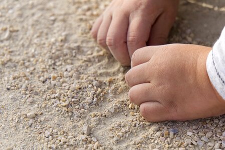 Sand pebble child's hand