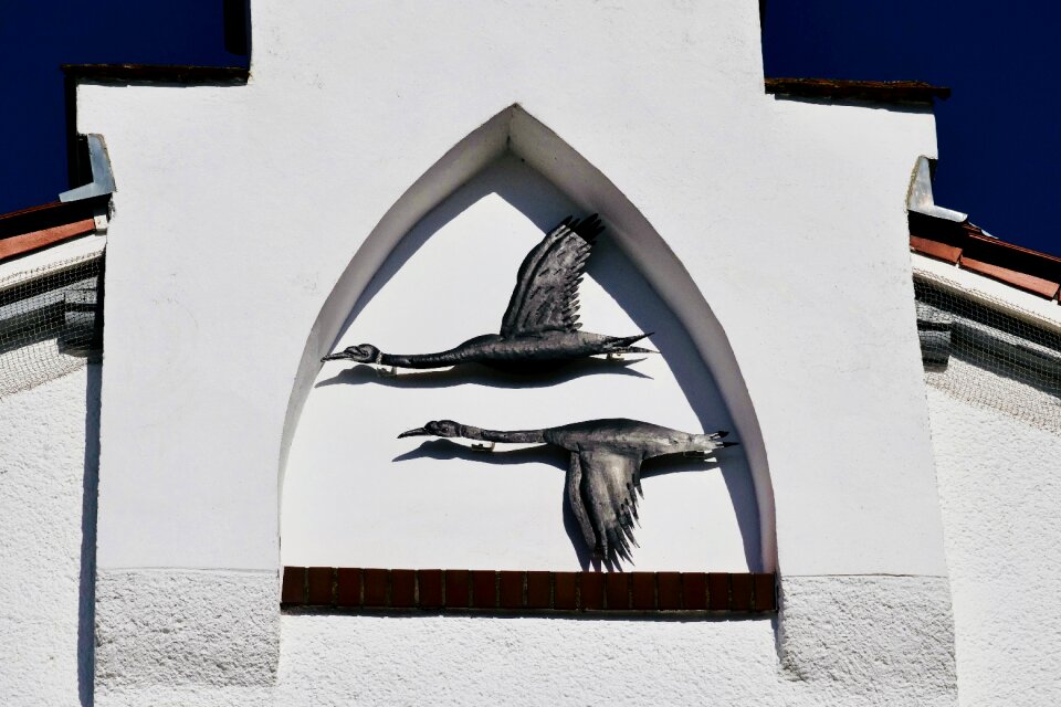 Motif cranes house facade