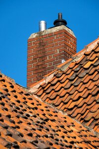 Roof shingles chimney brick photo