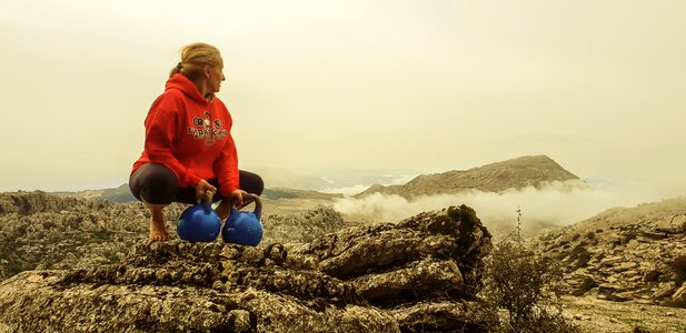 Blonde kettle bell mountain photo