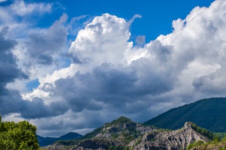 Billowing clouds alpine vegetation photo