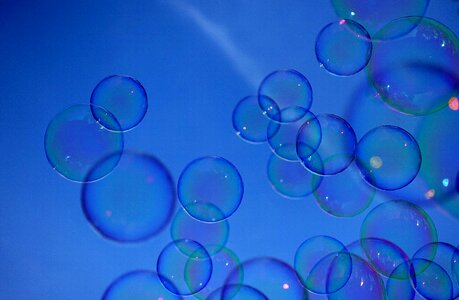 Make soap bubbles mirroring soapy water