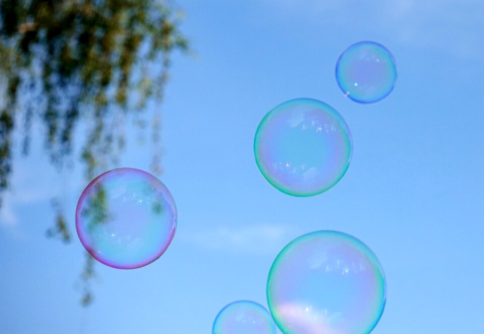 Make soap bubbles mirroring soapy water