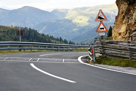 Road signs mountains road attention photo