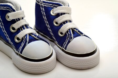 Close up children's shoes white photo