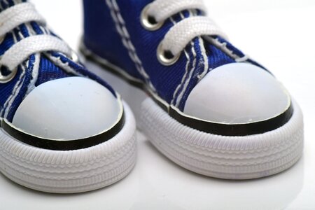 Close up children's shoes white photo