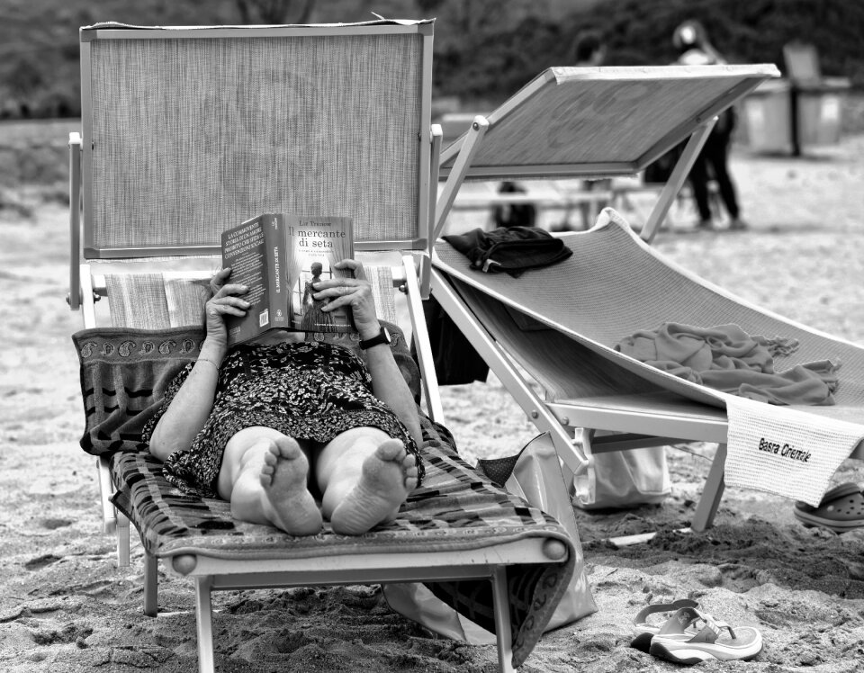 Reading book lying down photo