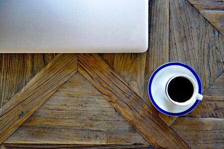 Notebook laptop coffee cup photo