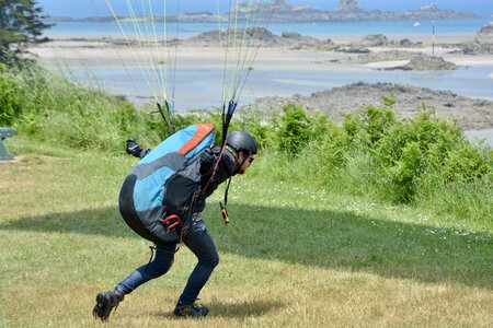 Paraglider pilots near takes off leisure sports free flight
