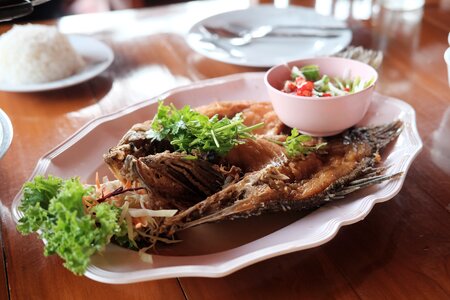 Fish snapper topped with sauce fried fish