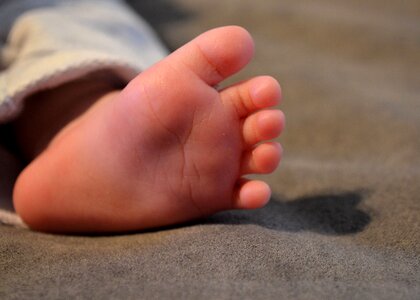 Ten newborn feet