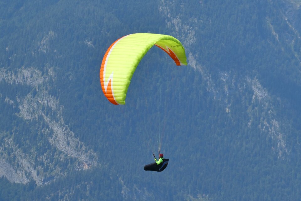Flying alpine paraglider