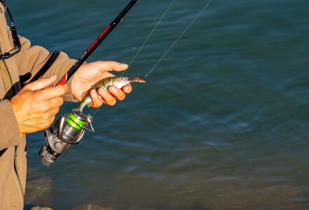 Person fishing rod fishhook photo