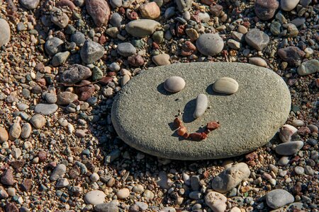 Pebble beach stone figure photo